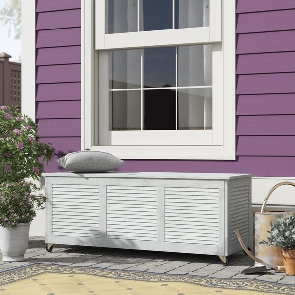 side of house with white decorative storage bench box available 