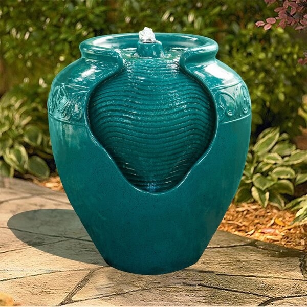teal vase-like garden fountain