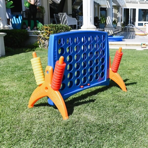 lawn with large plastic Connect 4-like game