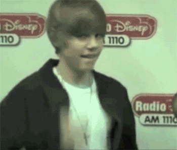 A young Justin Bieber giving us a very enthusiastic two thumbs up