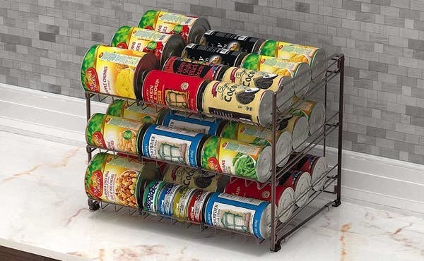 can organizer on counter holding various cans of food