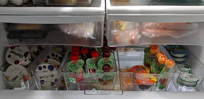 A reviewer's fridge looking organized with the storage bins