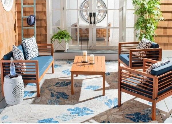 real wood bench, two chairs, and table with slat details and navy cushions