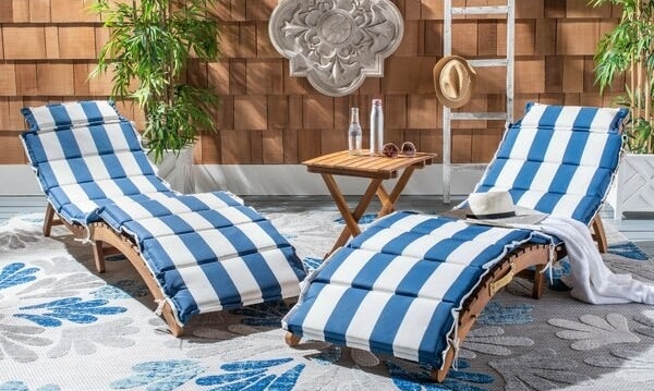 two wood chaise lounge chairs with blue and white cushions included, no arm rests
