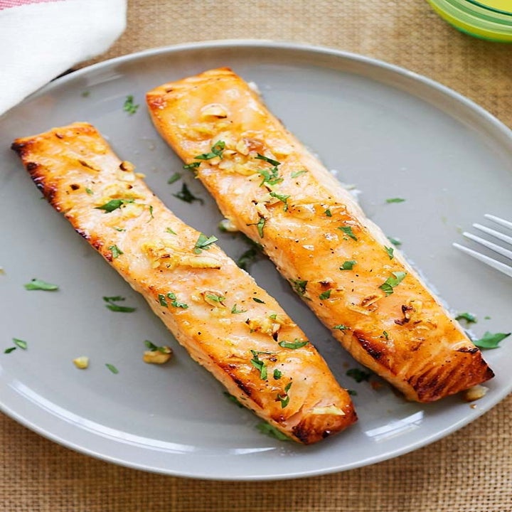 Two pieces of salmon baked in honey mustard sauce.