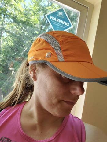 A reviewer in the orange hat
