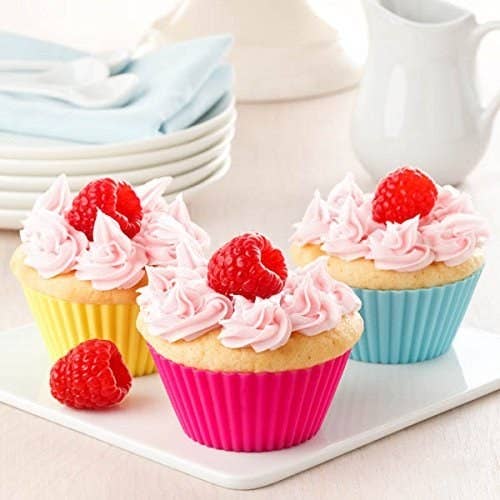 Reusable silicone cupcake moulds pictured with cupcakes.
