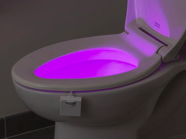 toilet with purple light inside the bowl