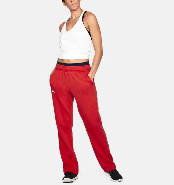 Model wearing a pair of bright red loose-fitting sweatpants