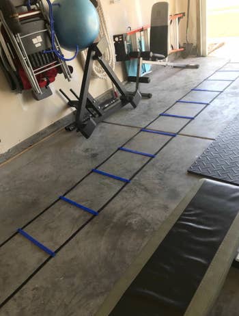 Reviewer places black agility ladder in their garage