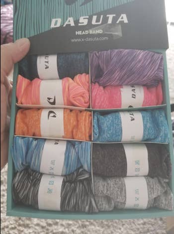 A reviewer showing the 10 colors the sweatbands come in 