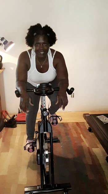 Reviewer on the stationary bike in their home