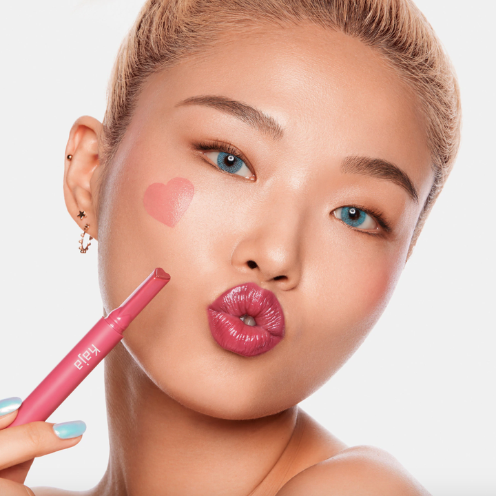 Model wearing the color and showing off glossy pigmented lips