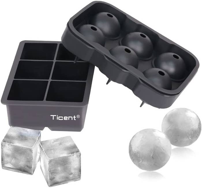 Two sets if jumbo ice cube molds — one spherical and one square — with frozen cubes.