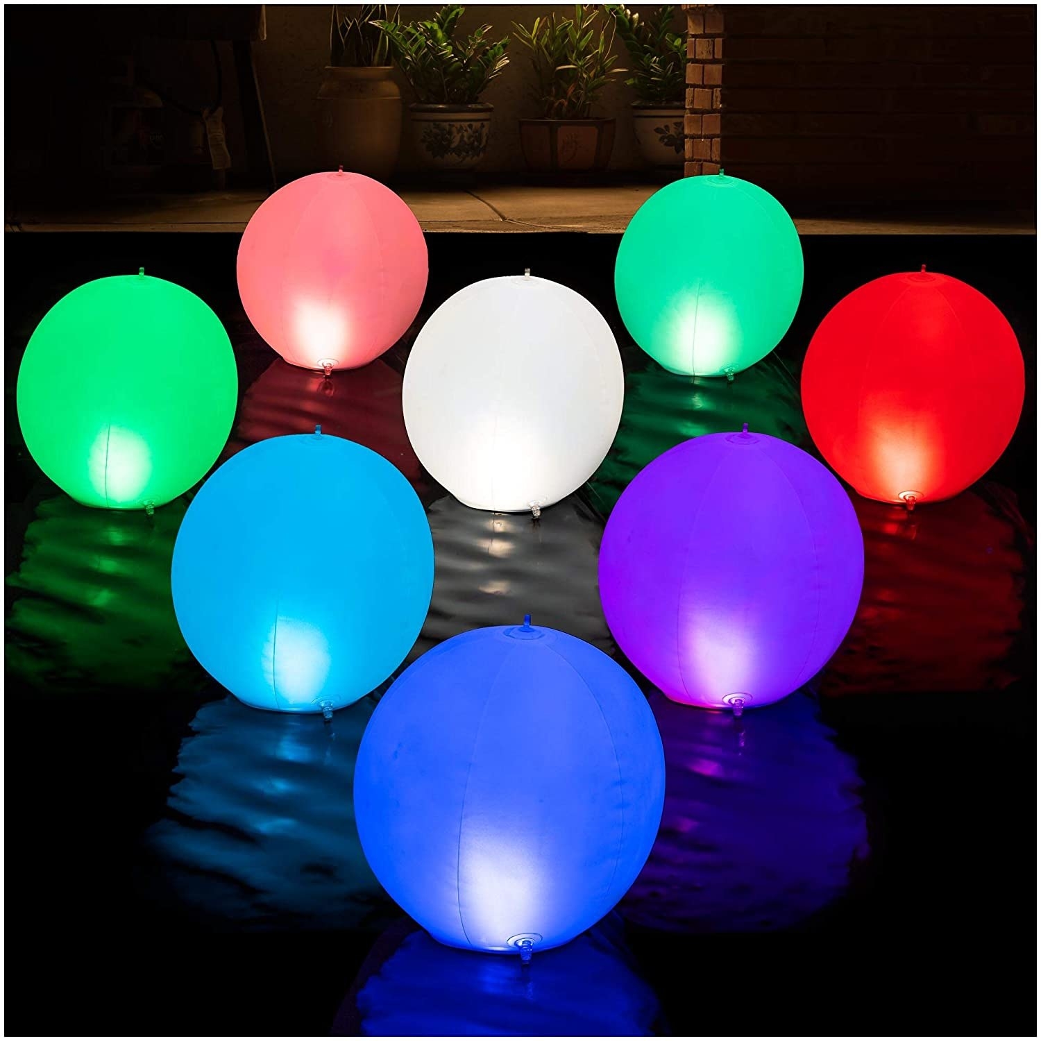 Colorful, balloon-shaped lights floating on the water