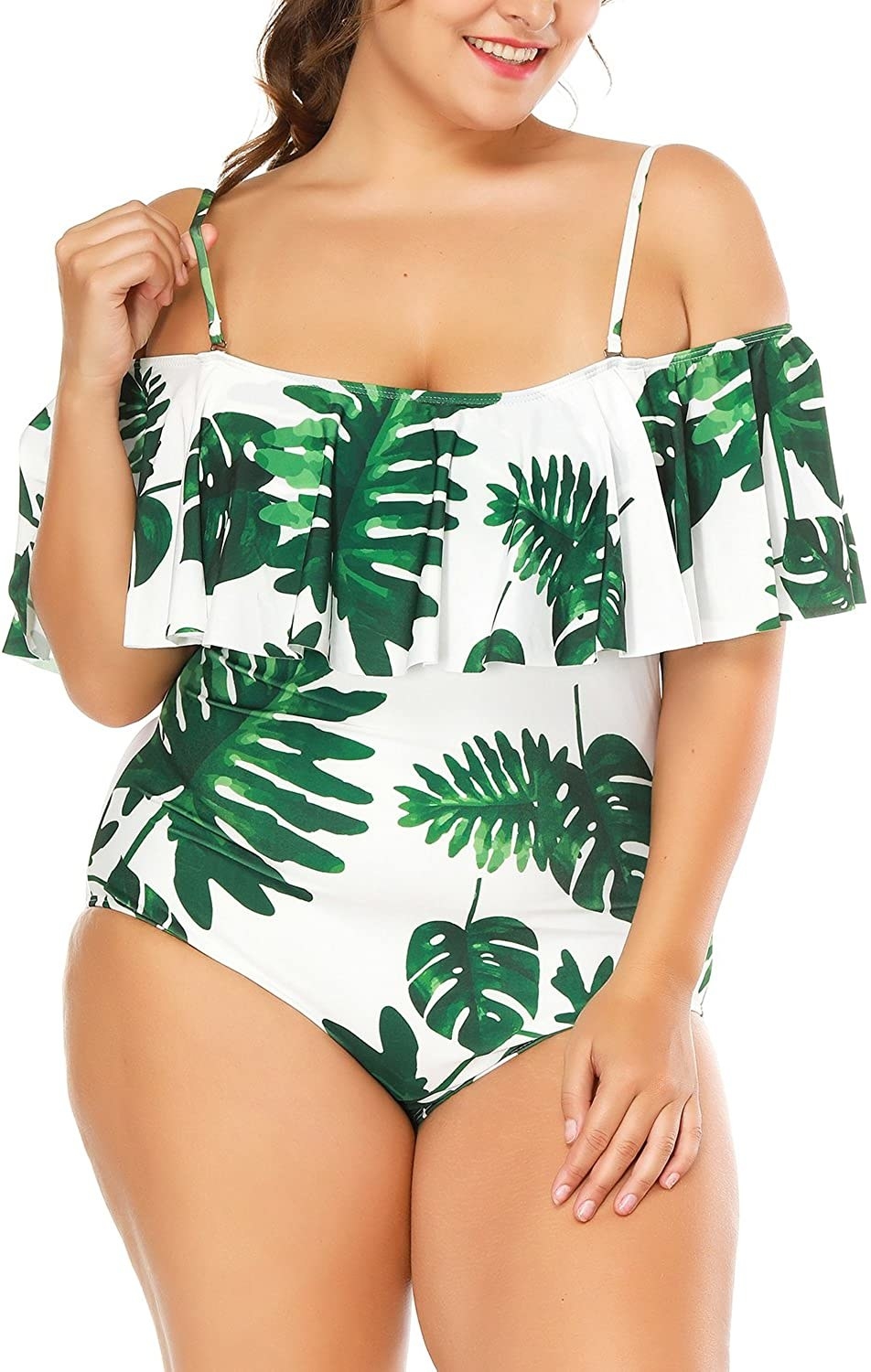 Model wearing the palm tree print swimsuit with ruffles