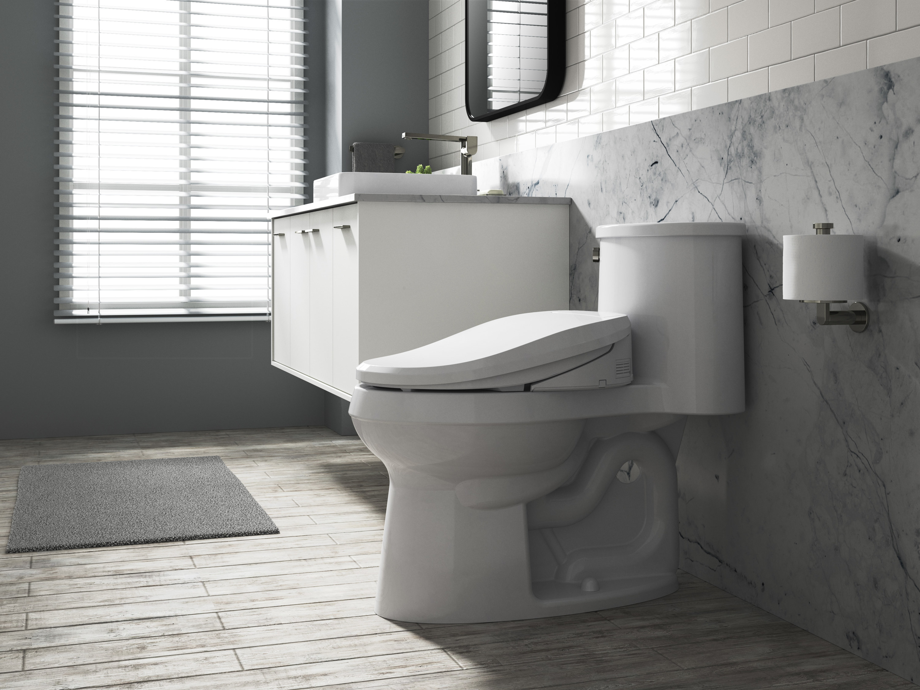 White heated bidet seat and toilet in bathroom