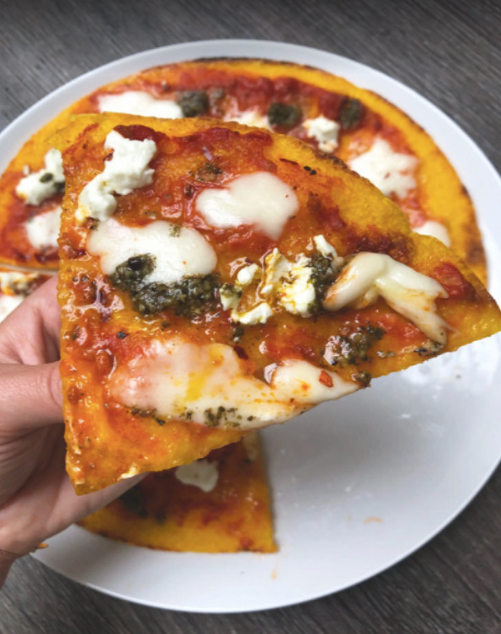 Butternut squash pizza with cheese and pesto.