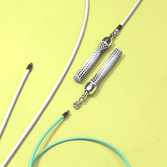 White and teal ropes against yellow backdrop