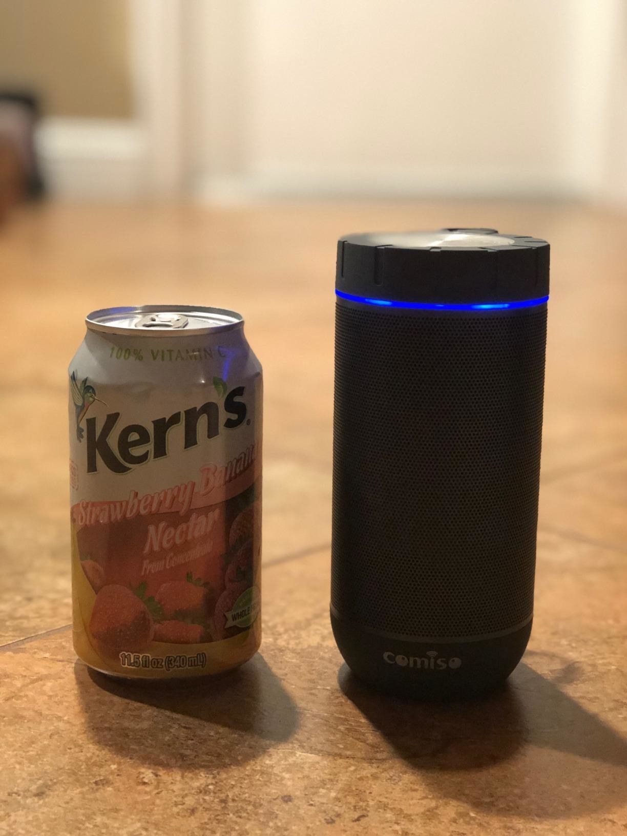 Reviewer photo showing the speaker is not much larger than a soda can