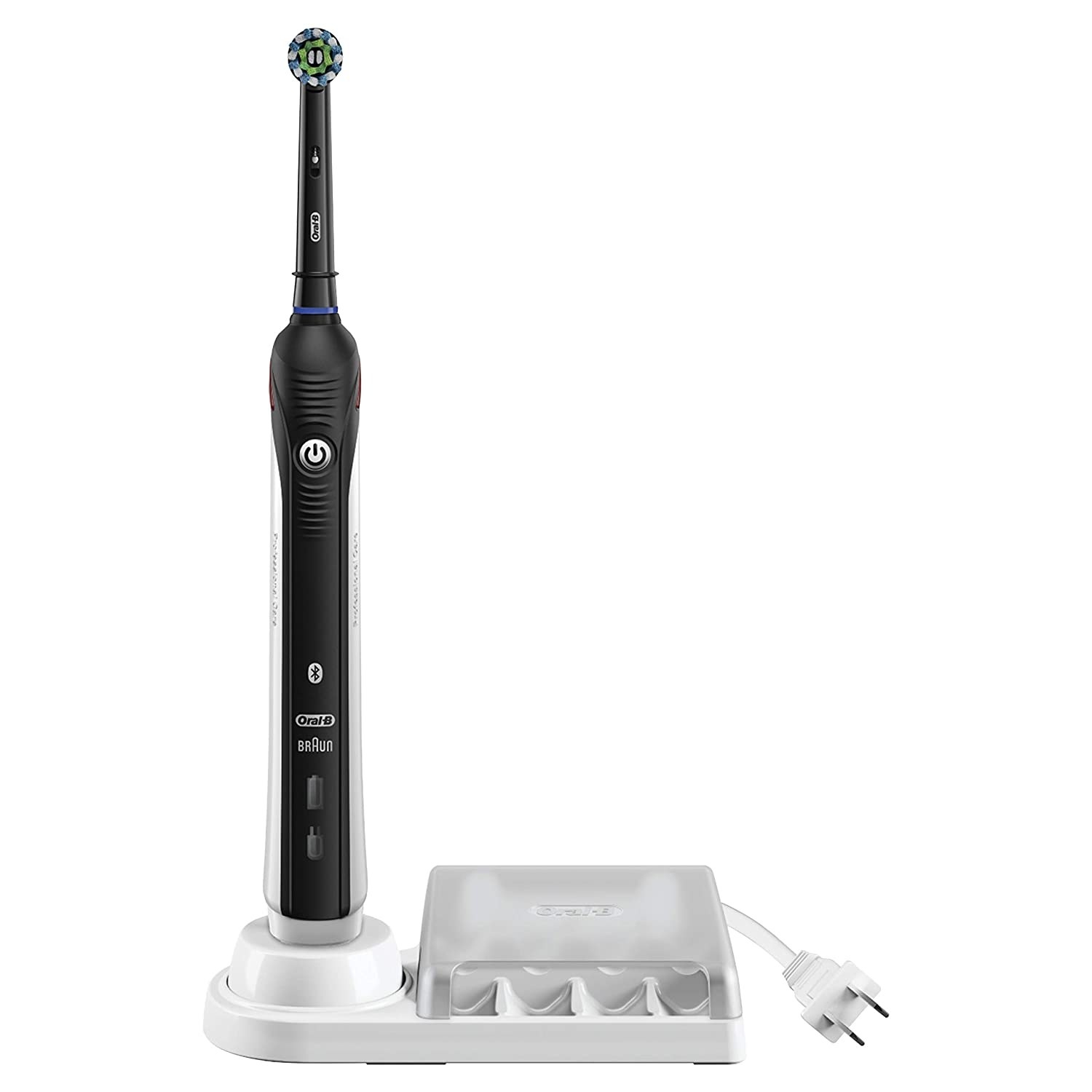 Black and white electric toothbrush standing on white base with power cord