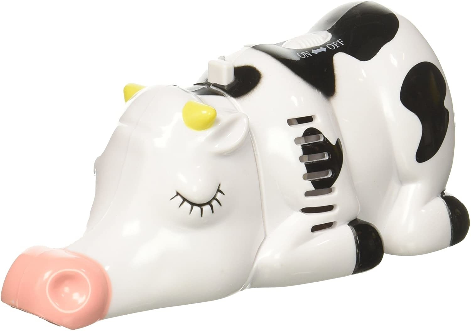 Small vacuum shaped like a cow in a seated position with its nose on the ground