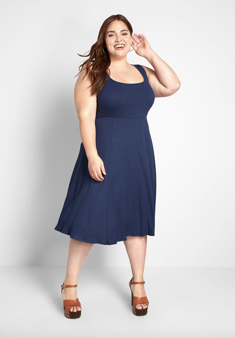 A model in the midi dress in navy blue 