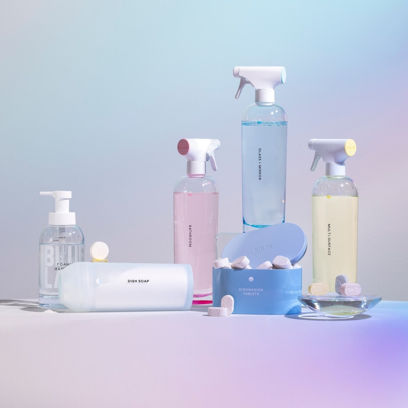 A product shot of the reusable spray bottles, tablets, and storage containers inside the kit