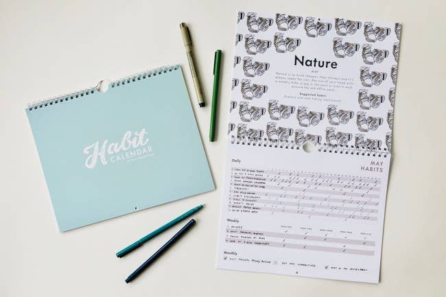 The habit calender, with a page open to the nature section with activities and days ticked off