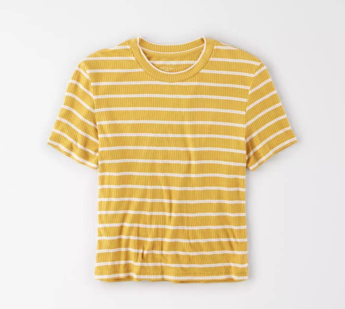 a yellow shirt with thin white stripes