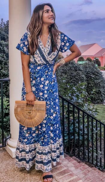 a reviewer in the dress in a darker blue