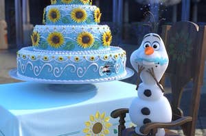 Olaf from Frozen eating a cake covered in sunflowers
