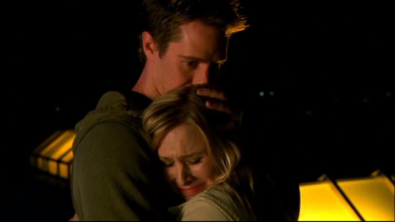 Logan holds Veronica as she cries into his arms