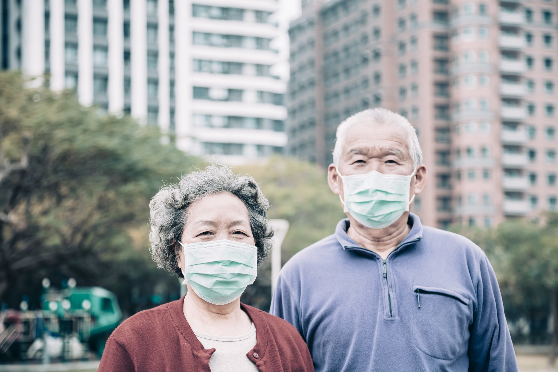 Photo of an elderly couple wearing face masks