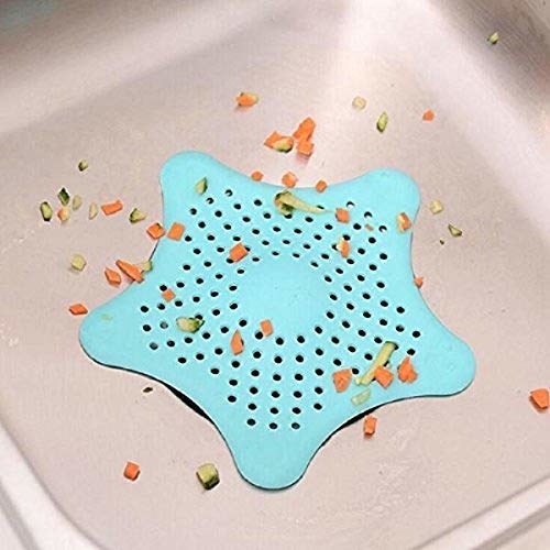 Star shaped sink catcher with food bits.