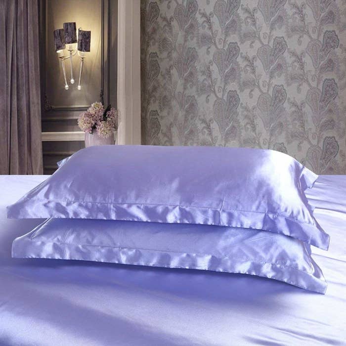 Pale purple satin pillow covers.