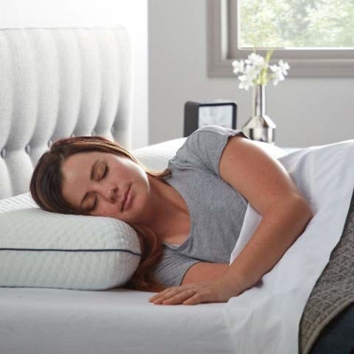 A person sleeping on the memory foam pillow.