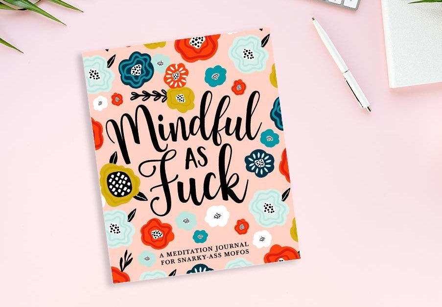 A book that says mindful as uck