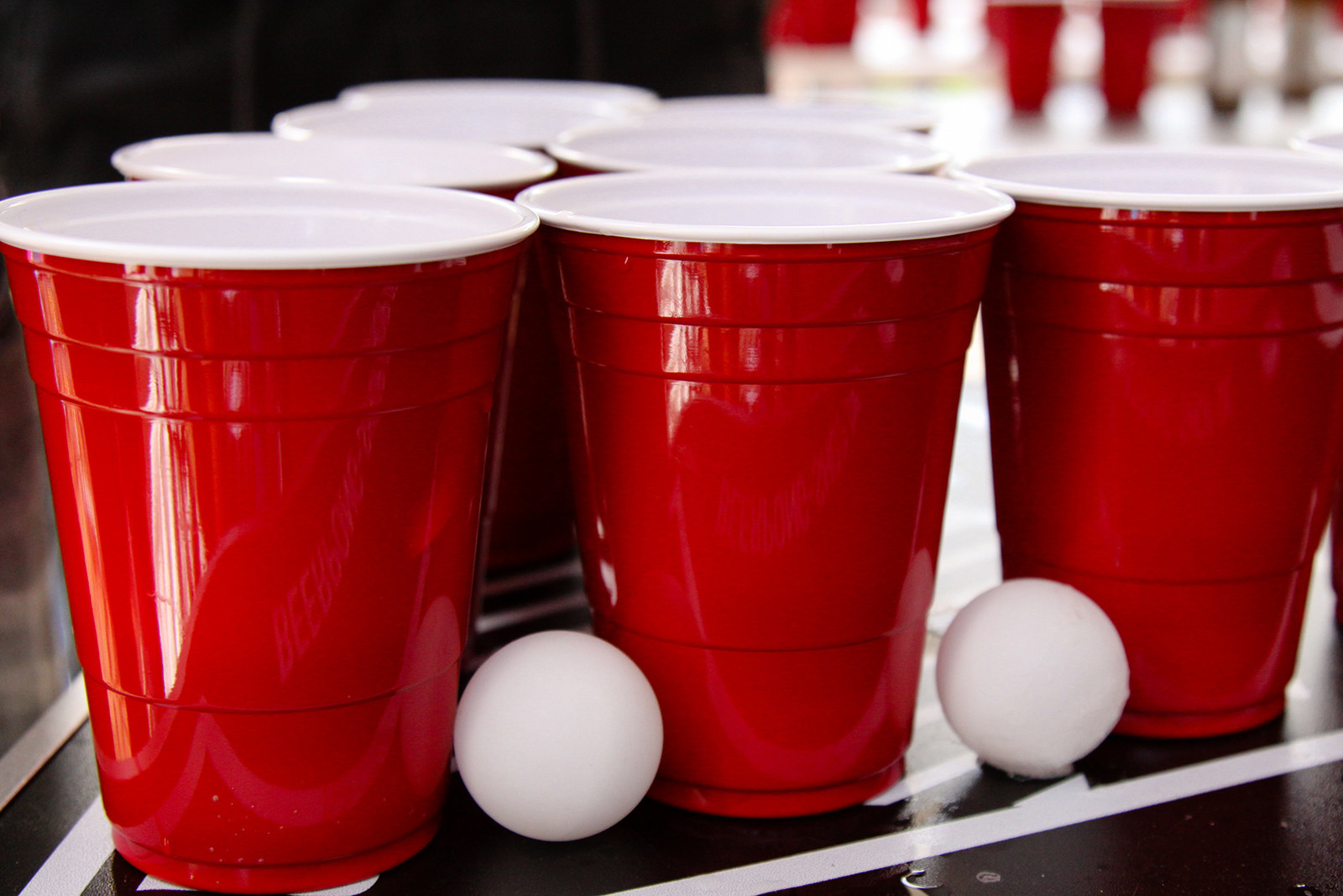 Red plastic cups set up for beer pong.