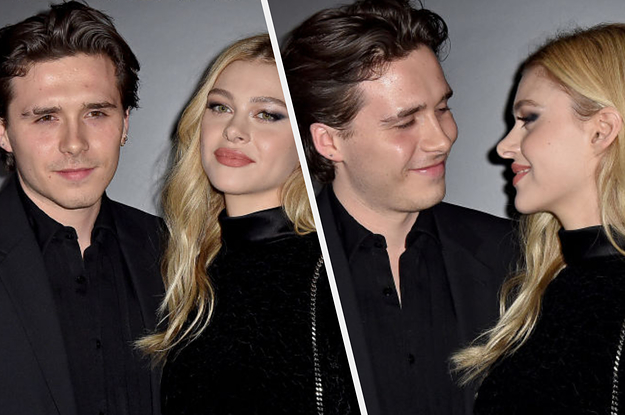 Brooklyn Beckham and Nicola Peltz on a red carpet side-by-side with them looking at each other