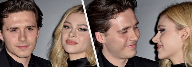 Brooklyn Beckham and Nicola Peltz on a red carpet side-by-side with them looking at each other