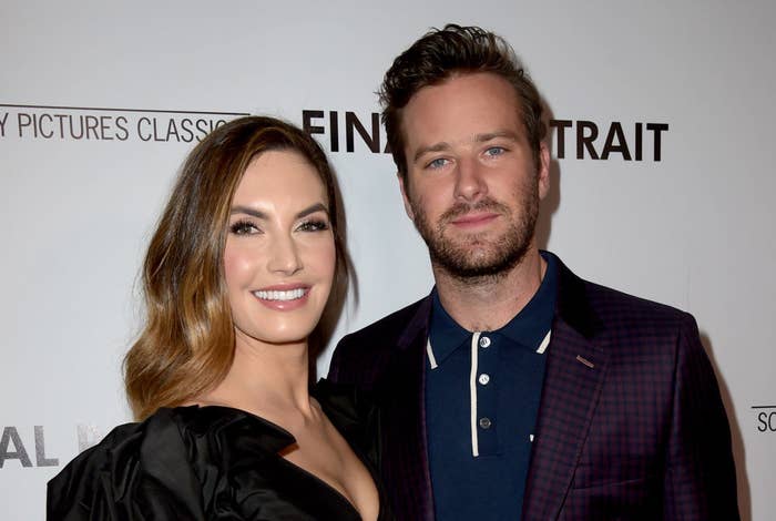 Elizabeth Chambers and Armie Hammer on a red carpet