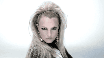 GIF of Britney Spears staring into the camera from her &quot;Work Bitch&quot; music video.