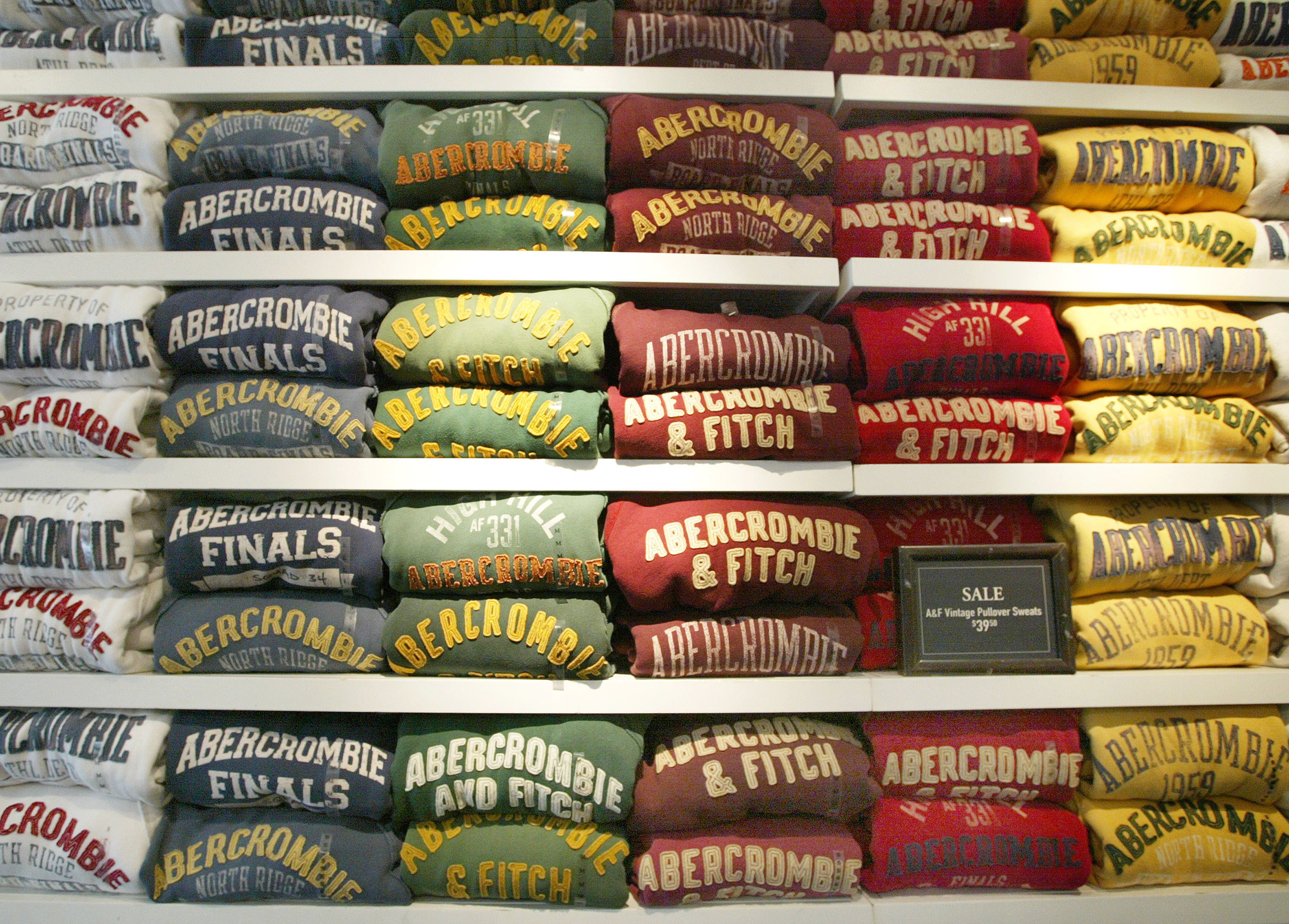 Five rows of Abercrombie &amp;amp; Fitch sweaters neatly folded on a shelf.