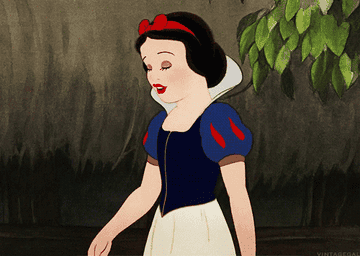 Snow White blows a kiss and waves goodbye