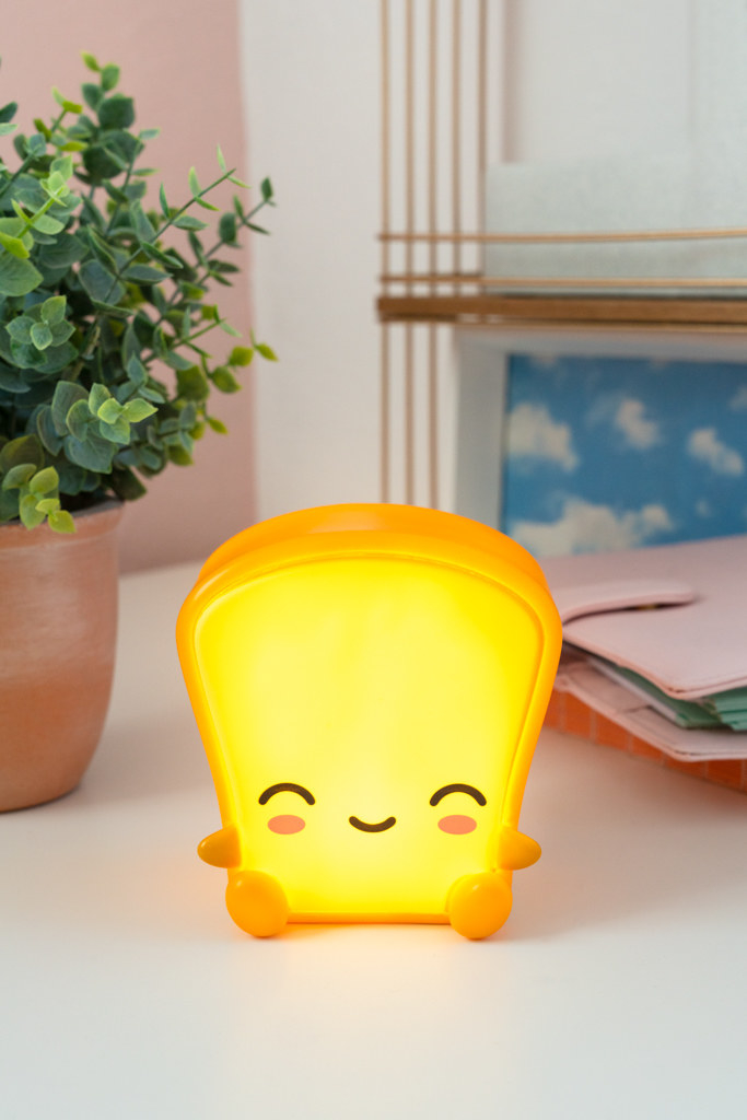 a smiling cute light shaped like a piece of toast