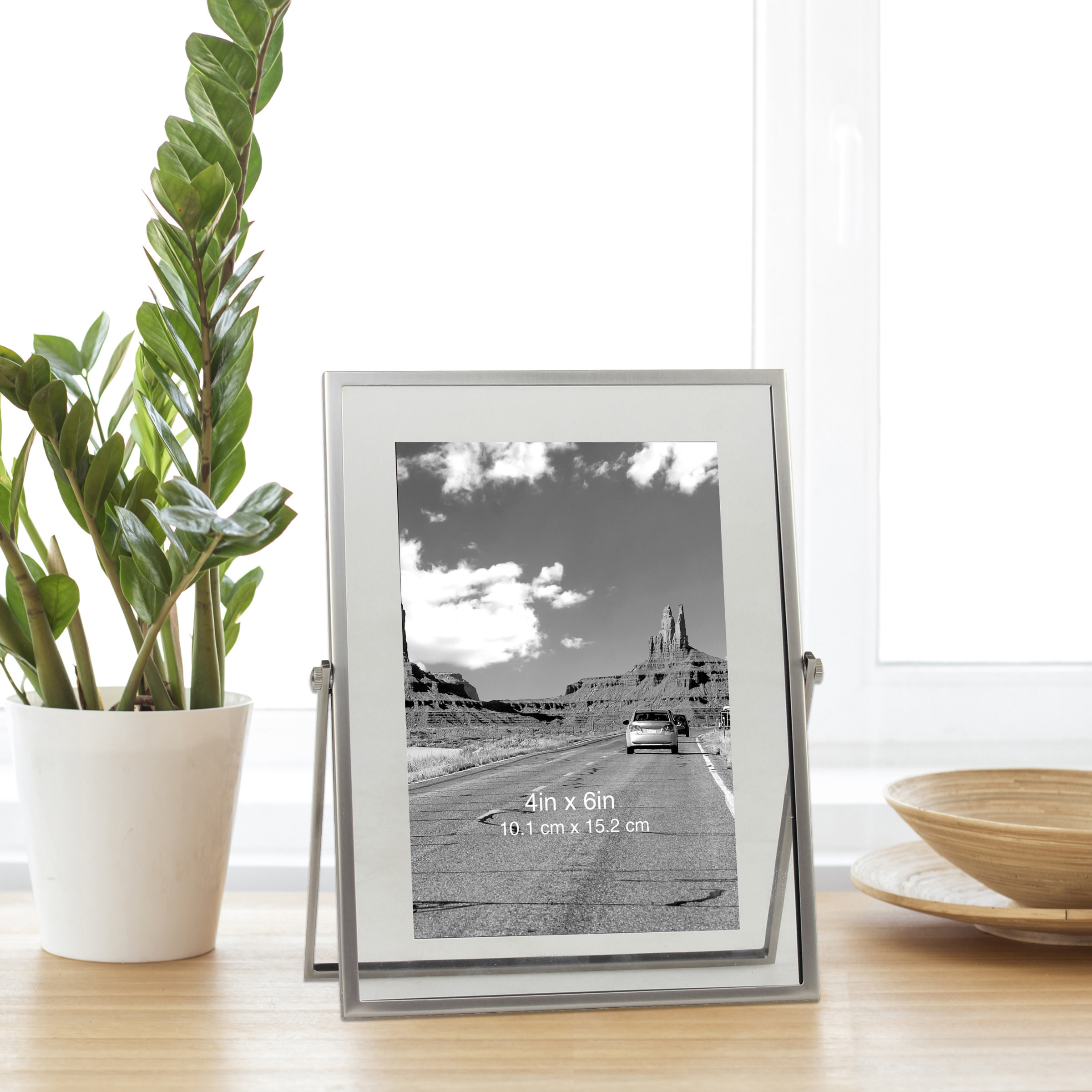 a silver picture frame with a silver stand