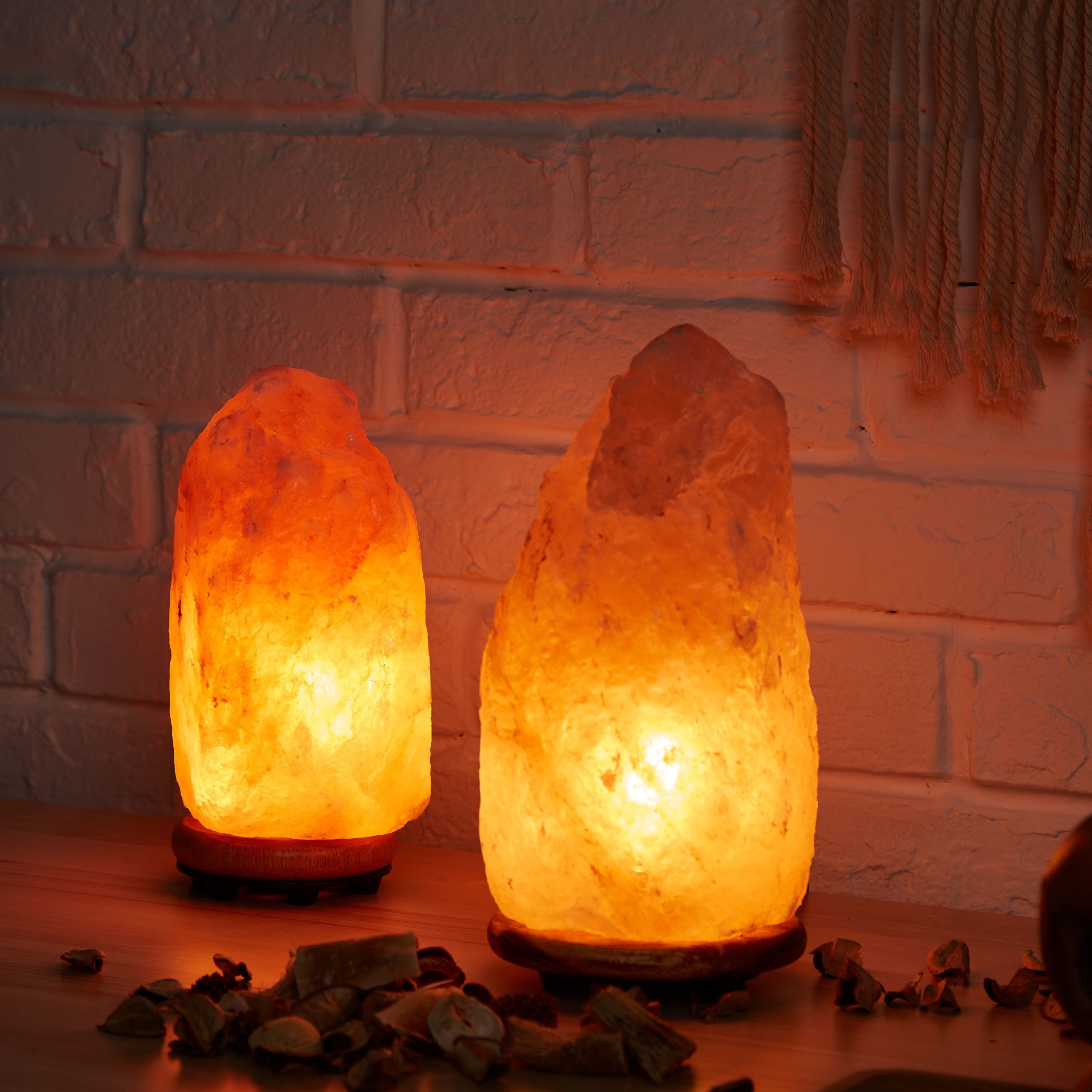 two glowing pink salt lamps