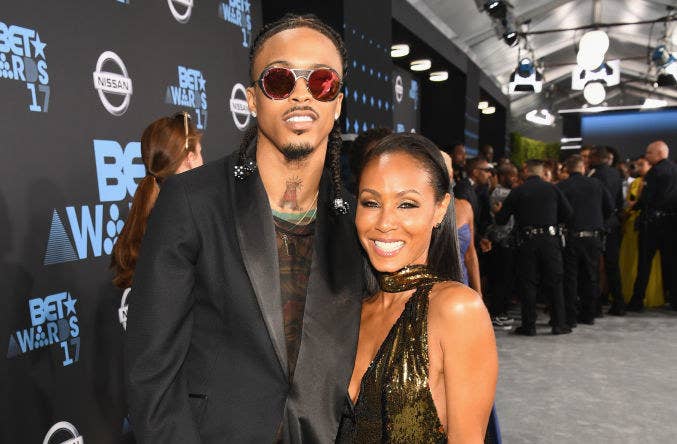 August Alsina and Jada Pinkett Smith on a red carpet 