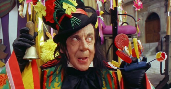 The Child Catcher with a bell and candy